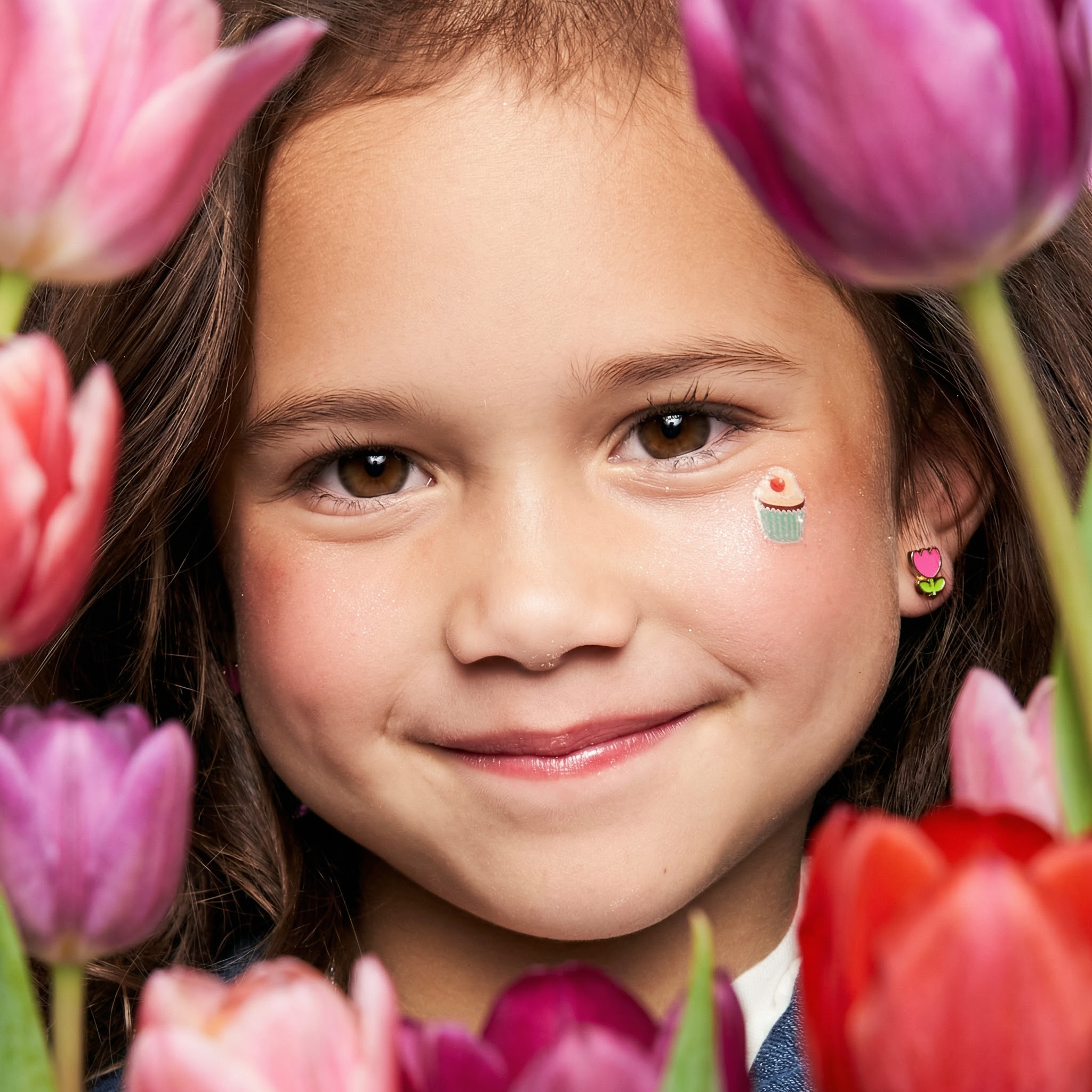 Girl wearing hypoallergenic kids earrings in Canada —  safe, nickel-free jewelry for sensitive ears by Girl Nation Canada