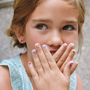 Deliciously scented Sweet Shop nail stickers for kids, featuring 25 cupcake and candy designs. A fun, sugar-free birthday gift for your granddaughter that releases a sweet scent when scratched.