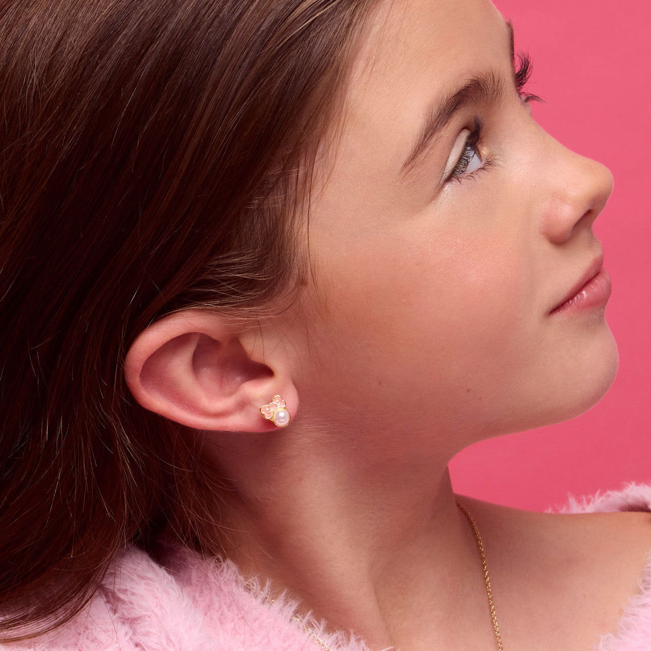 Close-up of the pink bow studs highlighting the skin-safe materials and comfortable back. Designed to be irritation-free and perfect for bridesmaids or sensitive ears.