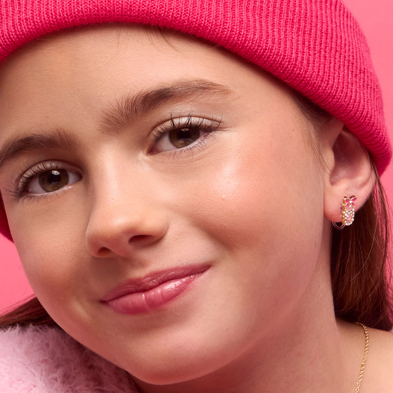 Close-up of the sparkling ballet slippers with a secure-clasp design, perfect for little dancers with sensitive, unpierced ears
