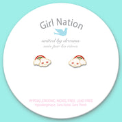 Detailed shot of the cloud and rainbow studs with a protective safety back. Family-approved and nickel-free, ensuring a comfortable fit for everyday play.