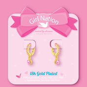 Pink solitaire drop huggie earrings on Girl Nation display card, hypoallergenic and nickel-free
