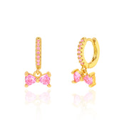 18K gold plated huggie earrings with pink CZ bow charm, front and side view