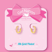 Pink CZ huggie earrings on Girl Nation display card, hypoallergenic and nickel-free