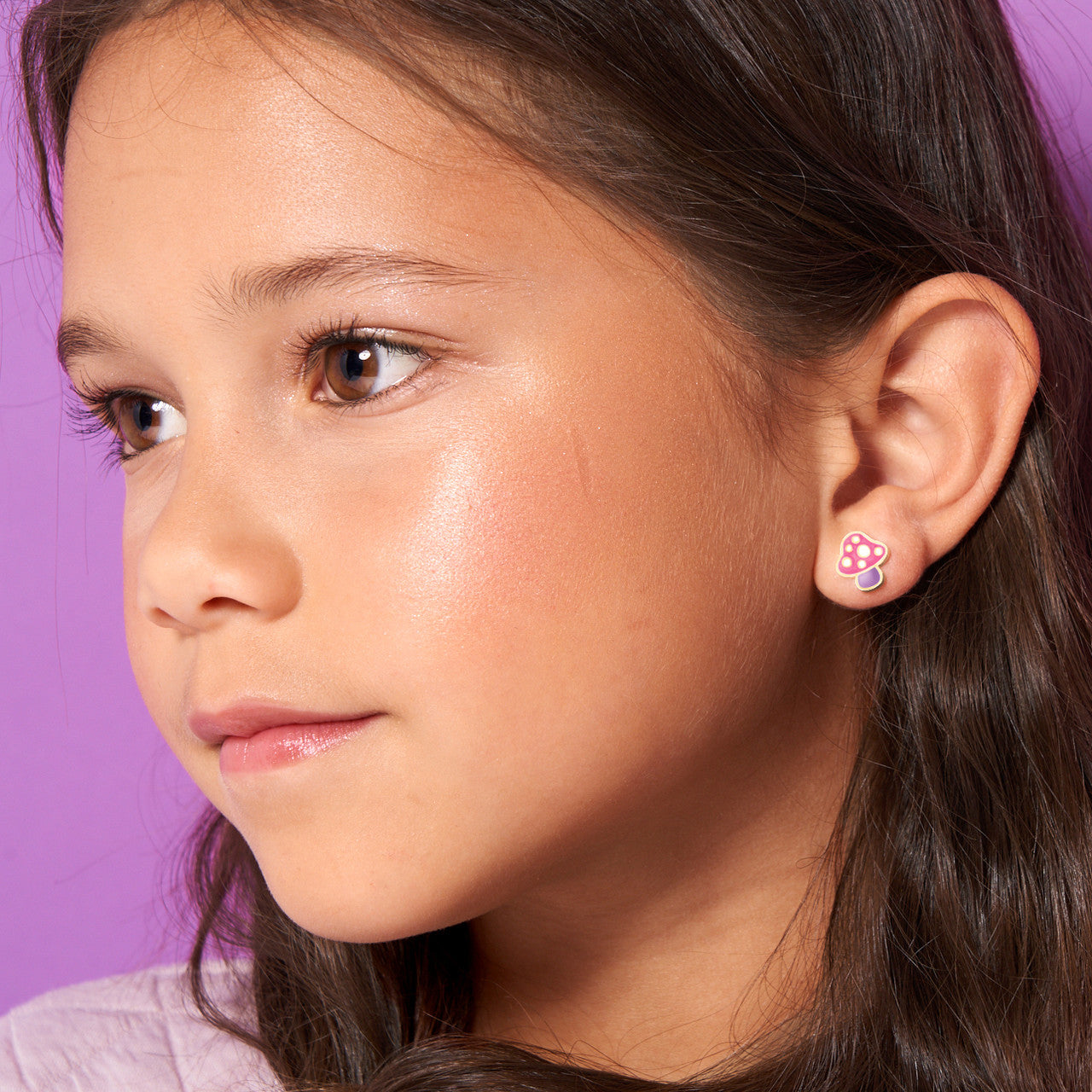 Macro view of the mushroom stud design featuring a high-quality surgical steel post. Durable and tarnish-proof, ensuring a safe and stylish look for young children.