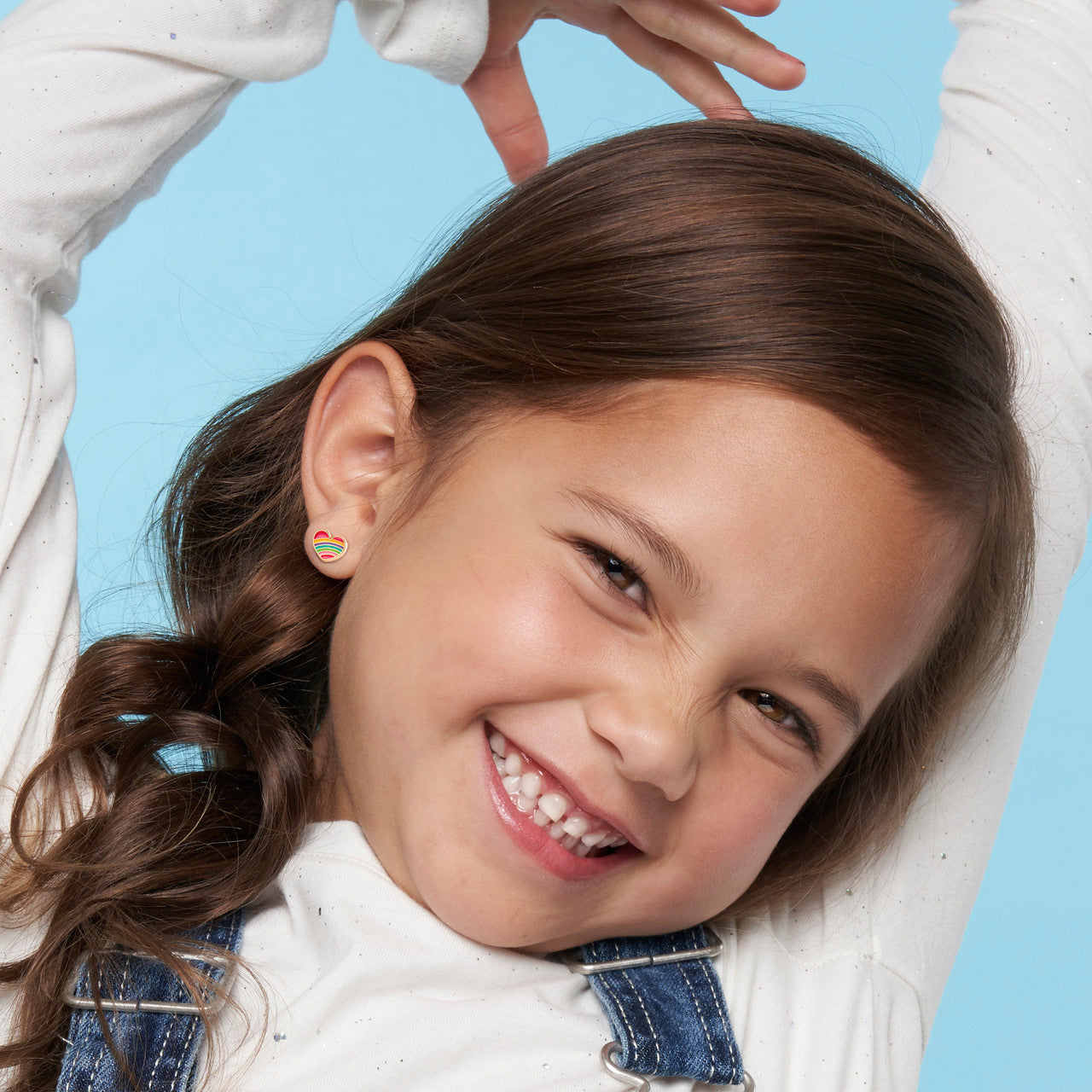 Vibrant Rainbow Heart clip-on earrings for kids, featuring a hypoallergenic and pain-free design. A colorful and safe jewelry gift for young girls with unpierced ears.