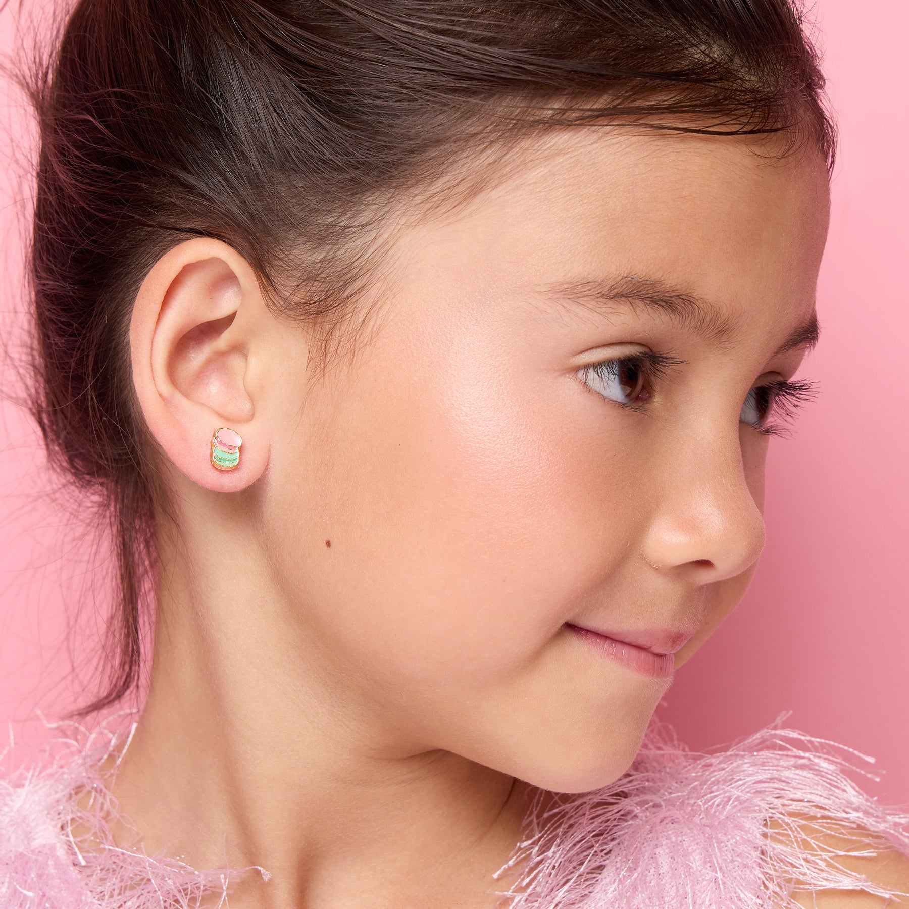 Young girl wearing hypoallergenic macaron stud earrings by Girl Nation Canada