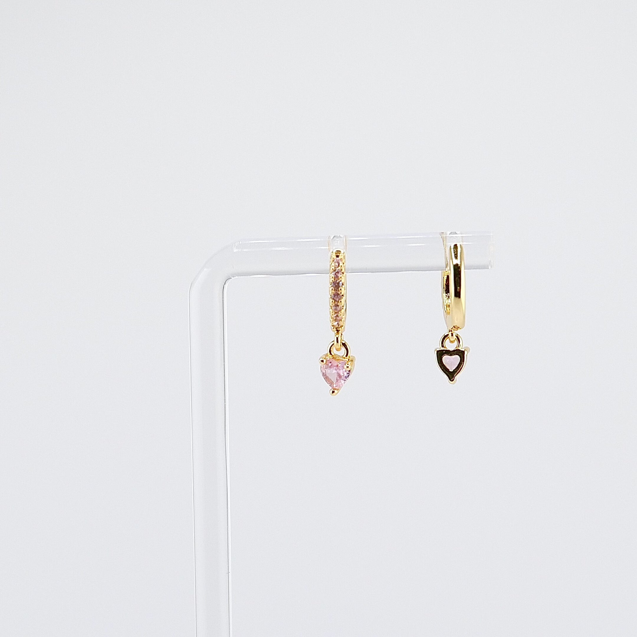 18K gold plated pink heart charm huggie earrings rotating on display, video