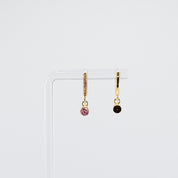 18K gold plated pink solitaire drop huggie earrings rotating on display, video
