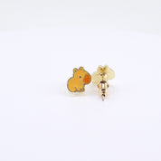  Golden-brown capybara stud earrings rotating on display, video