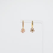 18K gold plated pink flower charm huggie earrings rotating on display, video
