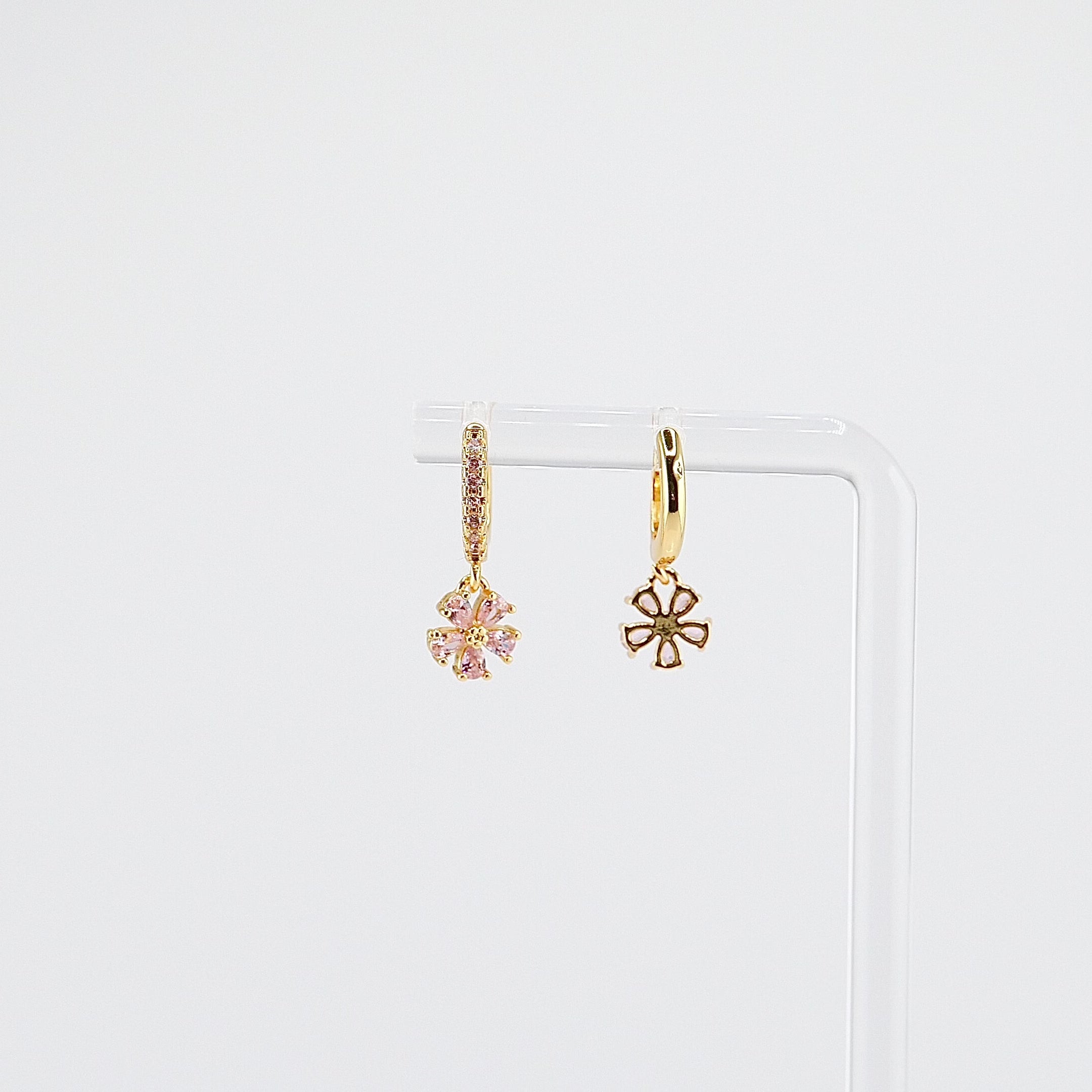 18K gold plated pink flower charm huggie earrings rotating on display, video
