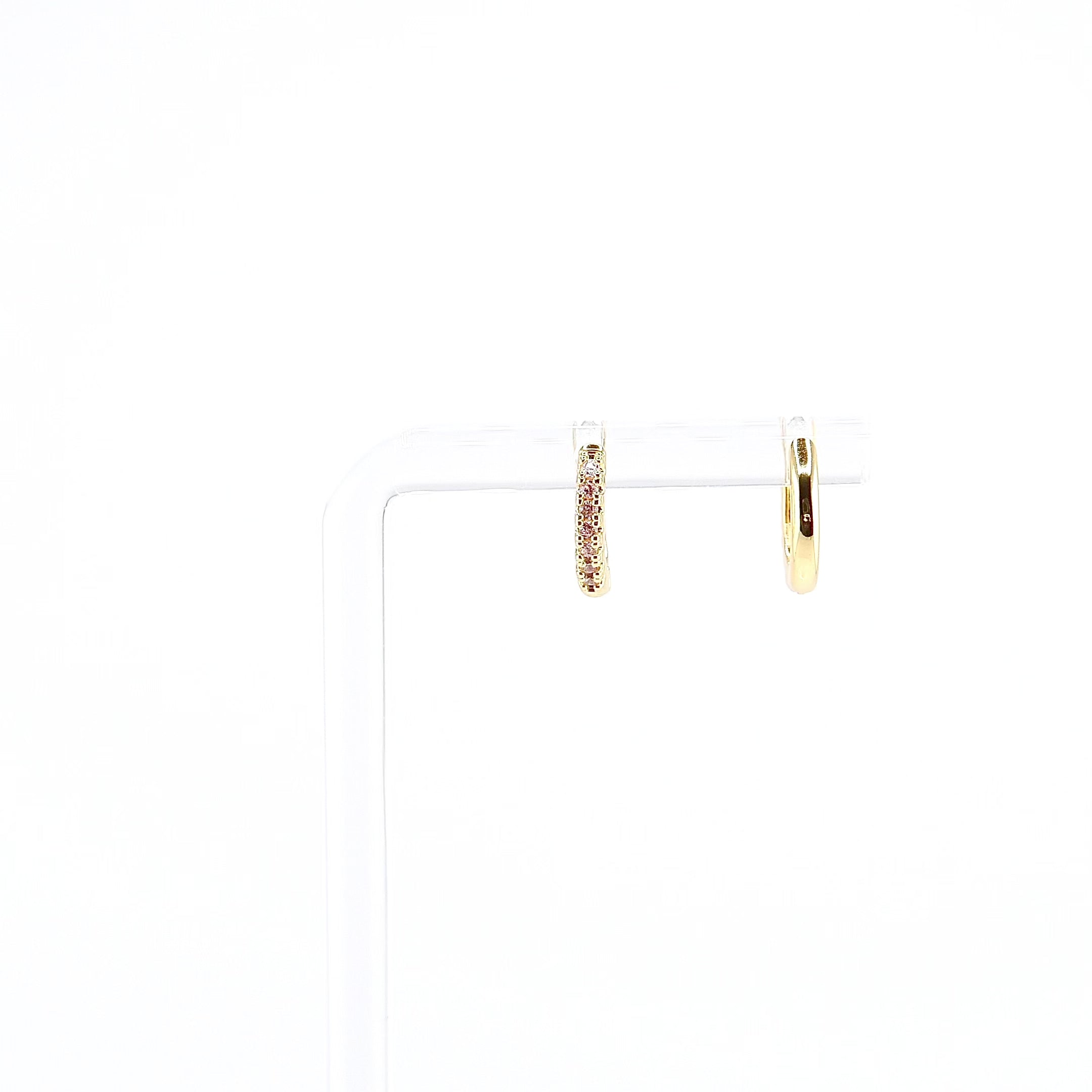 18K gold plated pink CZ huggie earrings rotating on display, video
