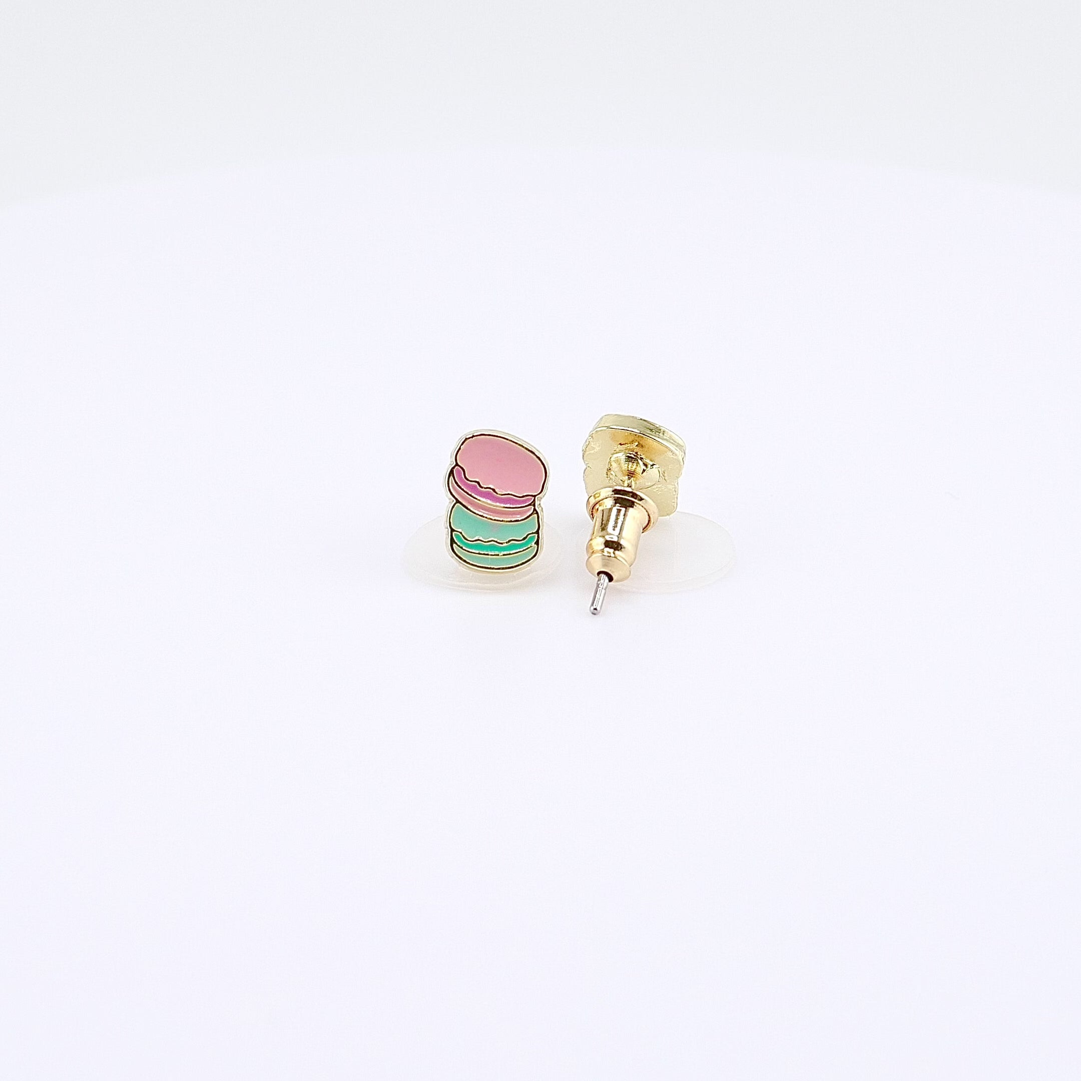 Pink and mint macaron stud earrings rotating on display, video
